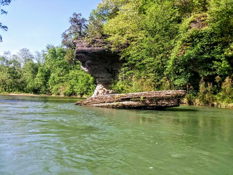 Bluffs and lard bluff rock sticking out of the water