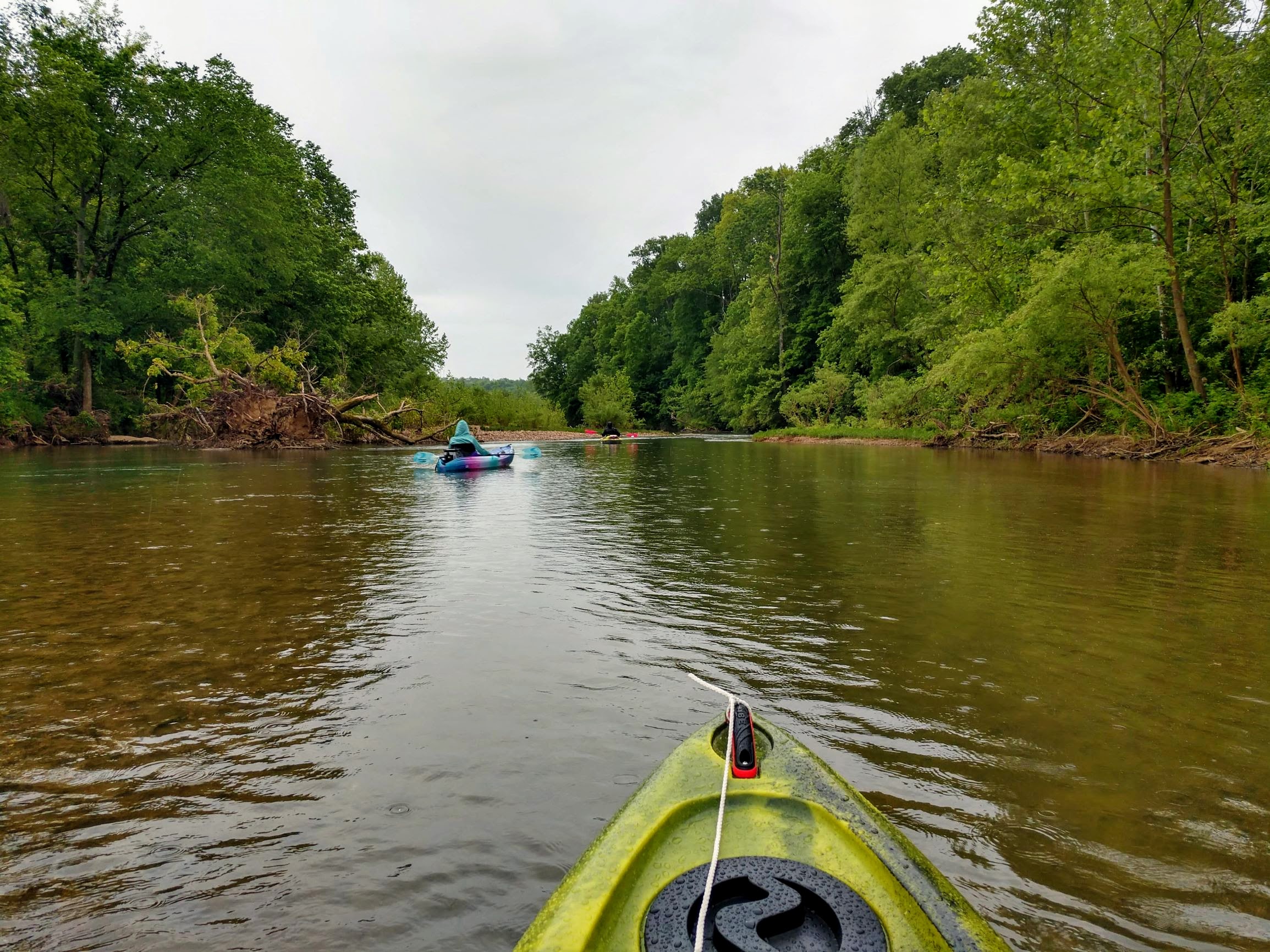 Kayaking down the river while its raining